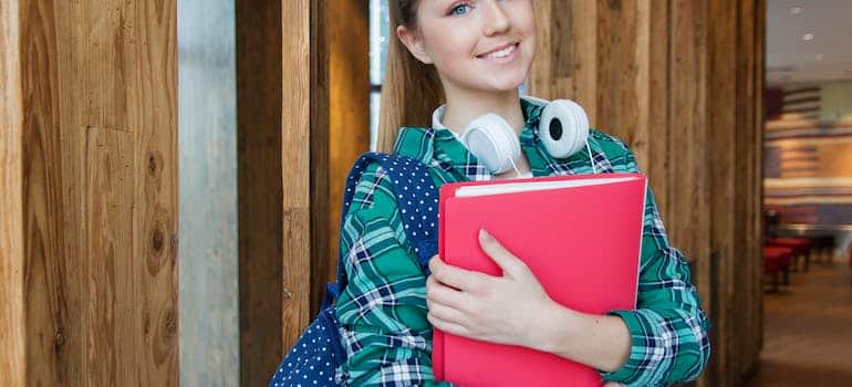 A student holding a book