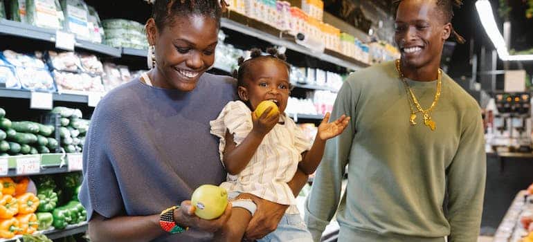 A family buying groceries