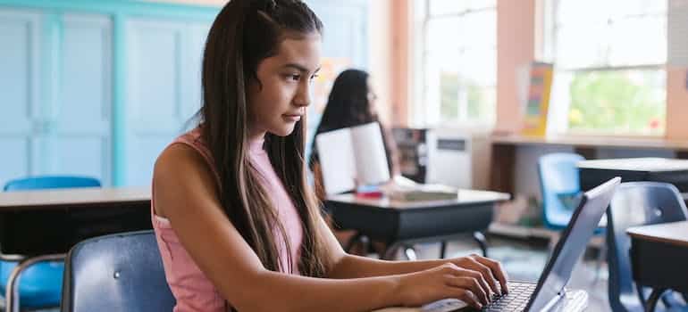 A girl in school after relocating from Florida to New York