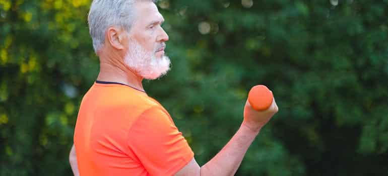 A senior man exercising