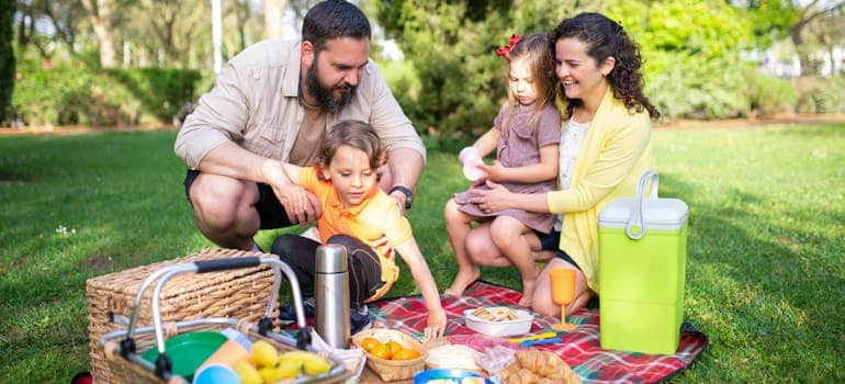 A family having picnic in the park enjoying family-friendly fun in Boca Raton