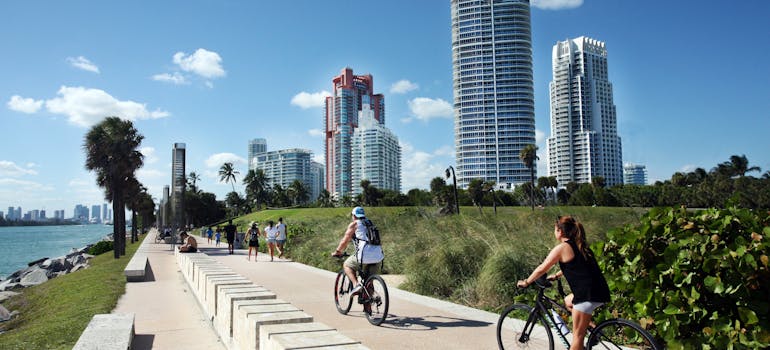 People biking in Miami after relocating from Hallandale Beach to Miami