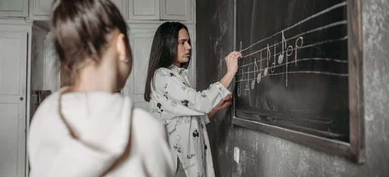 A girl having a music lesson 