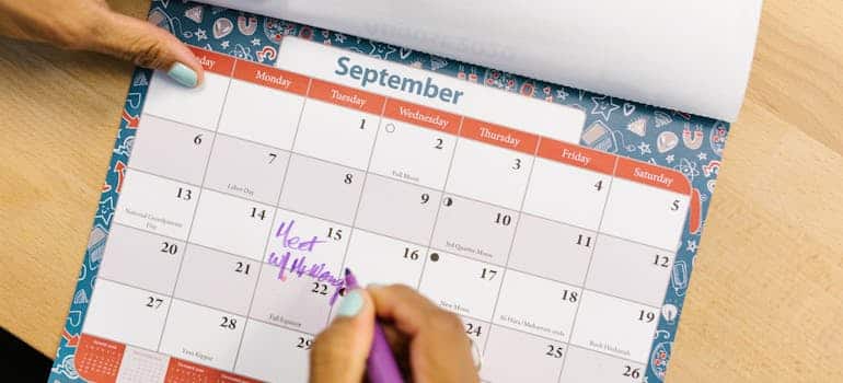 A person marking hid calendar 