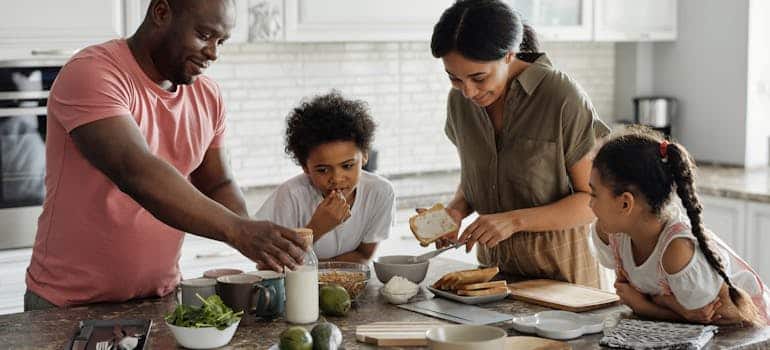 A family making breakfast in the kitchen 