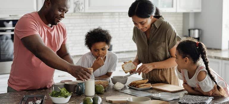 A family making breakfast in the kitchen