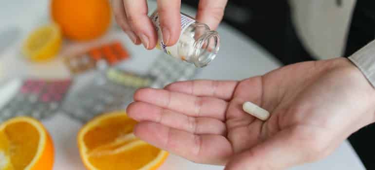 A person taking a vitamin 