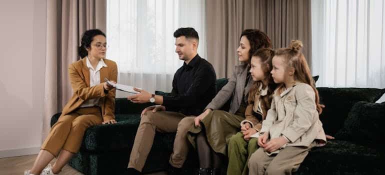 A family with a real estate agent