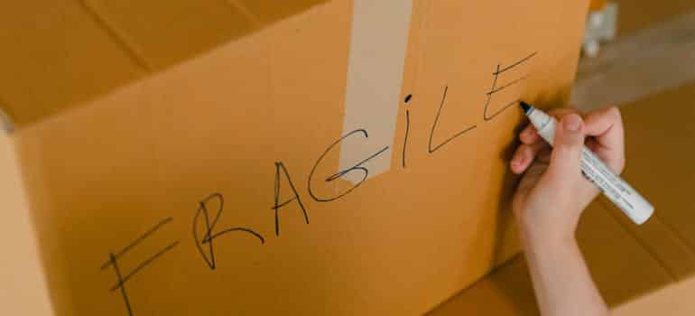 A moving box labelled fragile 